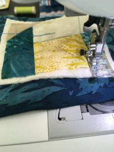 Stitch in the ditch quilting the patchwork coaster